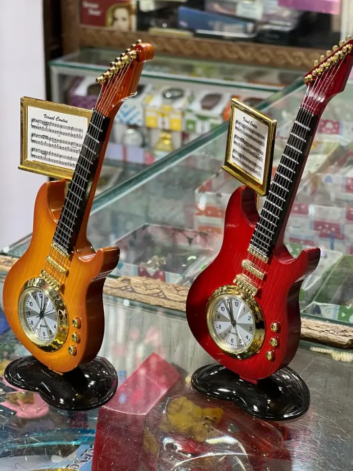 🎸 Guitar Table Clock – Rock Your Time! A stylish clock crafted like a mini electric guitar with music notes detail –