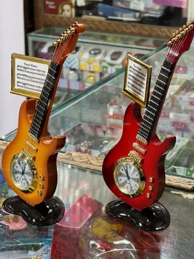 🎸 Guitar Table Clock – Rock Your Time! A stylish clock crafted like a mini electric guitar with music notes detail –